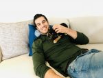 Dr. Evan Antin Smiling with pup